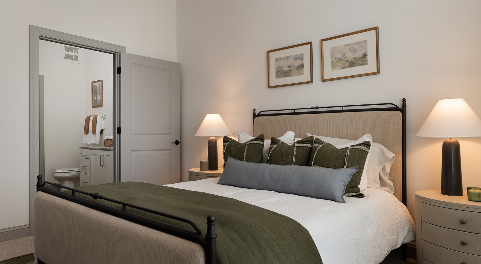 bedroom with bed end tables and lamps