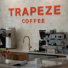 the inside of a coffee shop with a sign